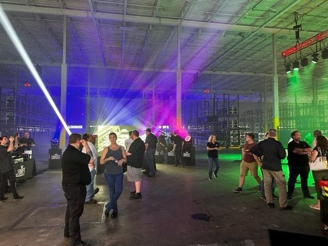 Chauvet open house attendees having lighting fixtures demonstrated to them on the Main Light Tri-State shop floor.